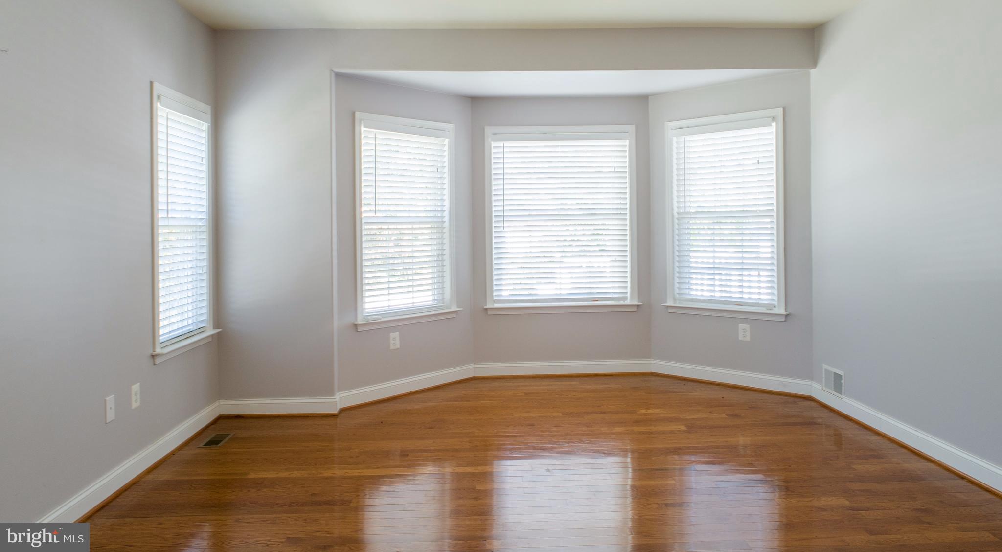 824 Andover Road Linthicum, MD 21090 - Photo 10 of 29 a view of empty room with wooden floor and fan