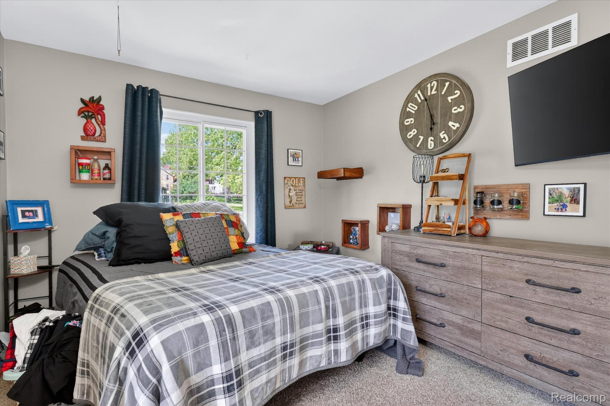 3860 East Commerce Road Commerce Township, MI 48382 - Photo 34 of 72 Spacious bedroom featuring light neutral wall paint, a large window with natural light, and plush carpet flooring