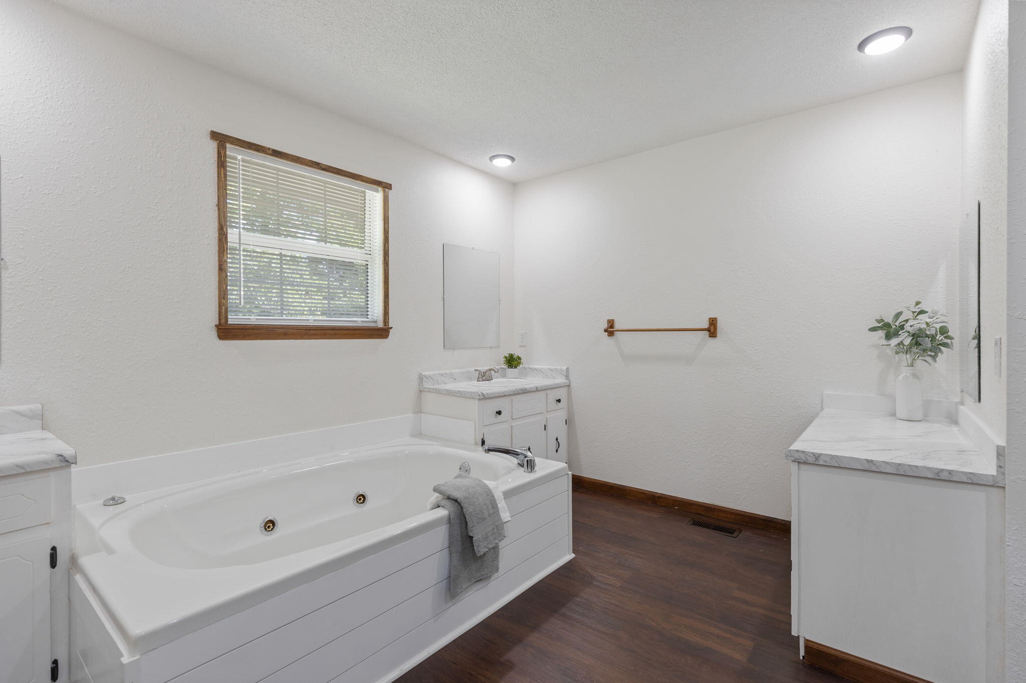 9814 Lakeside Road Harrison, TN 37341 - Photo 17 of 35 a bathroom with a bathtub a sink and a window