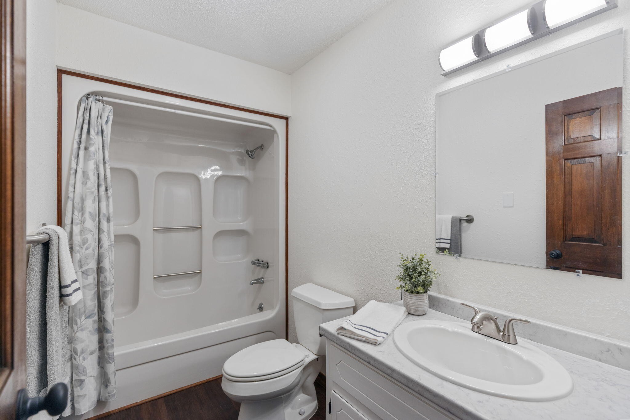 9814 Lakeside Road Harrison, TN 37341 - Photo 20 of 35 a bathroom with a sink a toilet and shower