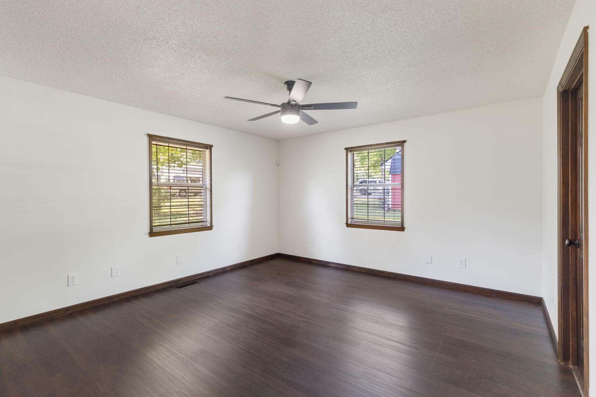 9814 Lakeside Road Harrison, TN 37341 - Photo 22 of 35 a view of an empty room with a window and wooden floor