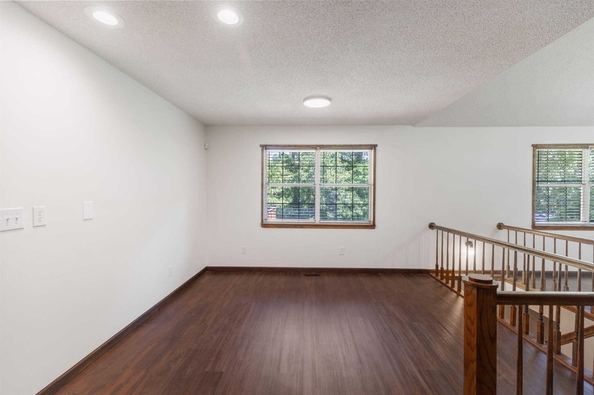 9814 Lakeside Road Harrison, TN 37341 - Photo 7 of 35 an empty room with wooden floor and windows