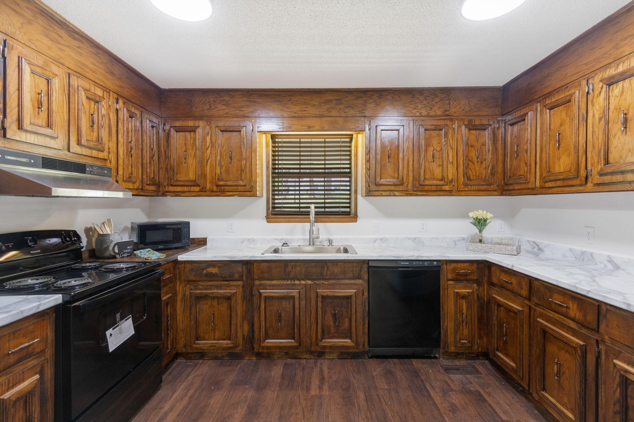 9814 Lakeside Road Harrison, TN 37341 - Photo 9 of 35 a kitchen with a sink stove top oven and cabinets