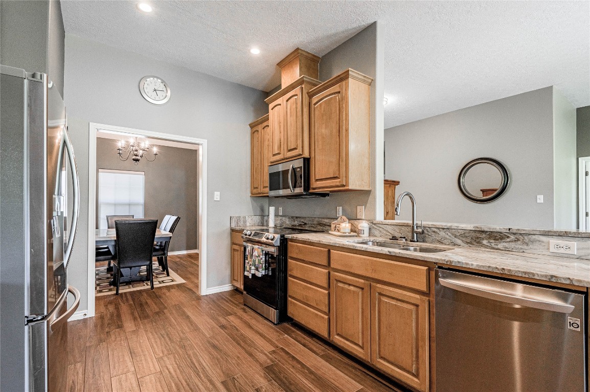 22 Greenway Drive Trinity, TX 75862 - Photo 15 of 29 a kitchen with a sink stove and chairs