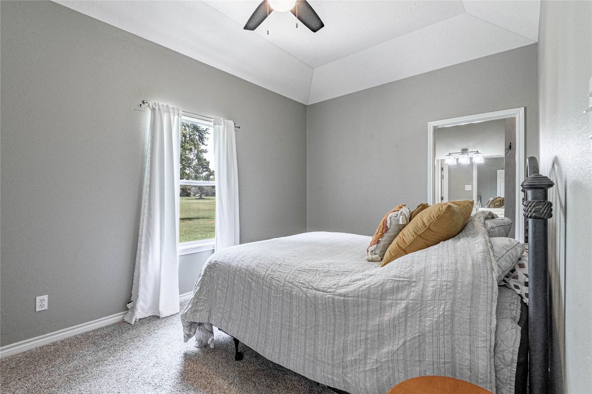 22 Greenway Drive Trinity, TX 75862 - Photo 24 of 29 a bedroom with a bed and a chandelier