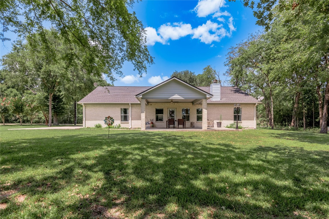 22 Greenway Drive Trinity, TX 75862 - Photo 3 of 29 a front view of a house with a garden
