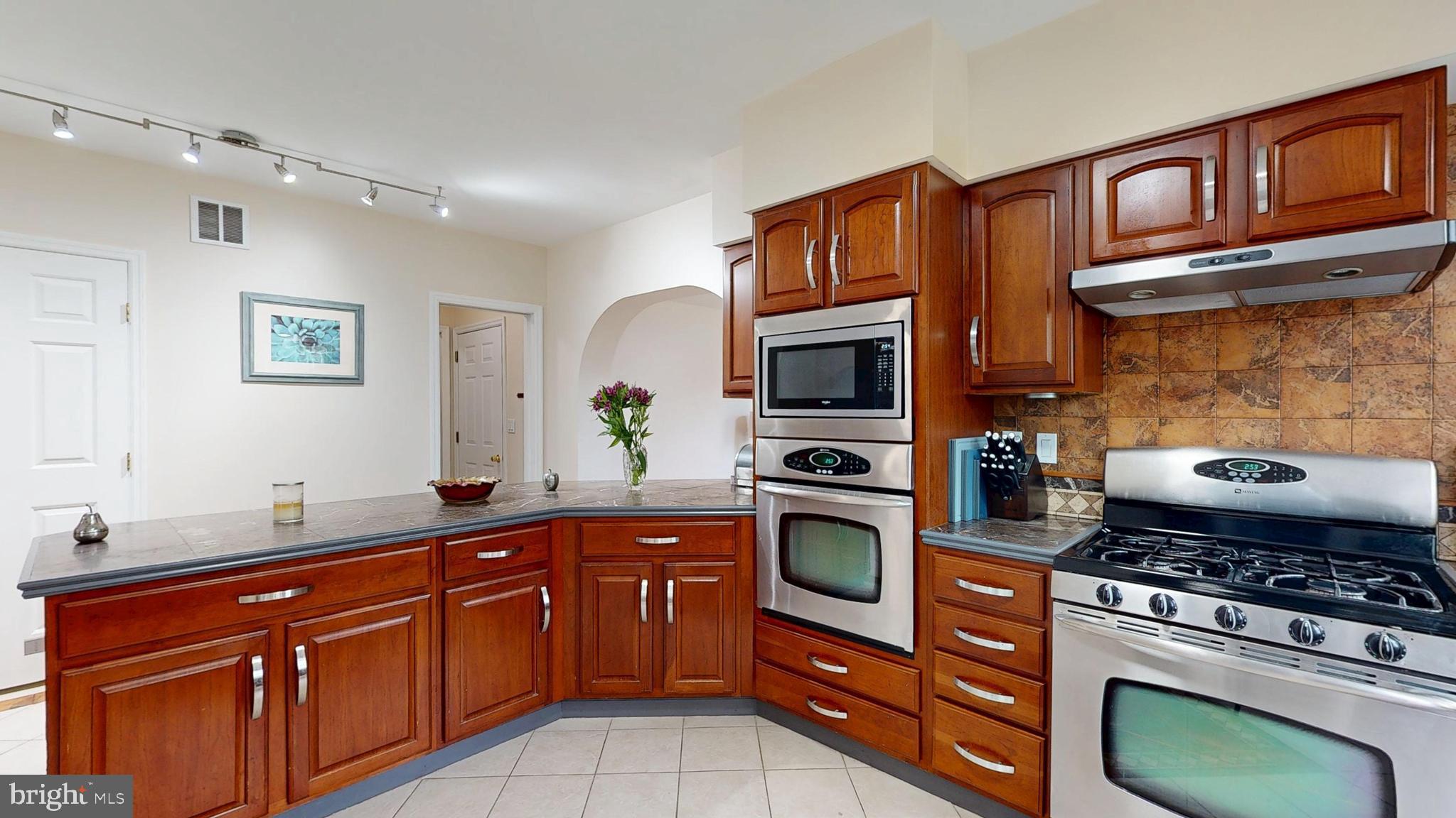226 Ark Road Mount Laurel, NJ 08054 - Photo 29 of 60 a kitchen with stainless steel appliances granite countertop a stove a sink and a microwave