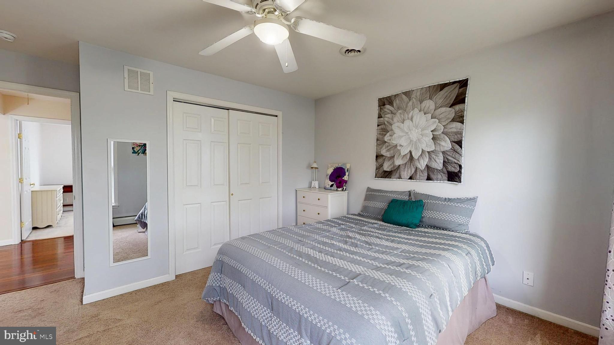 226 Ark Road Mount Laurel, NJ 08054 - Photo 38 of 60 a bedroom with a bed and a chandelier