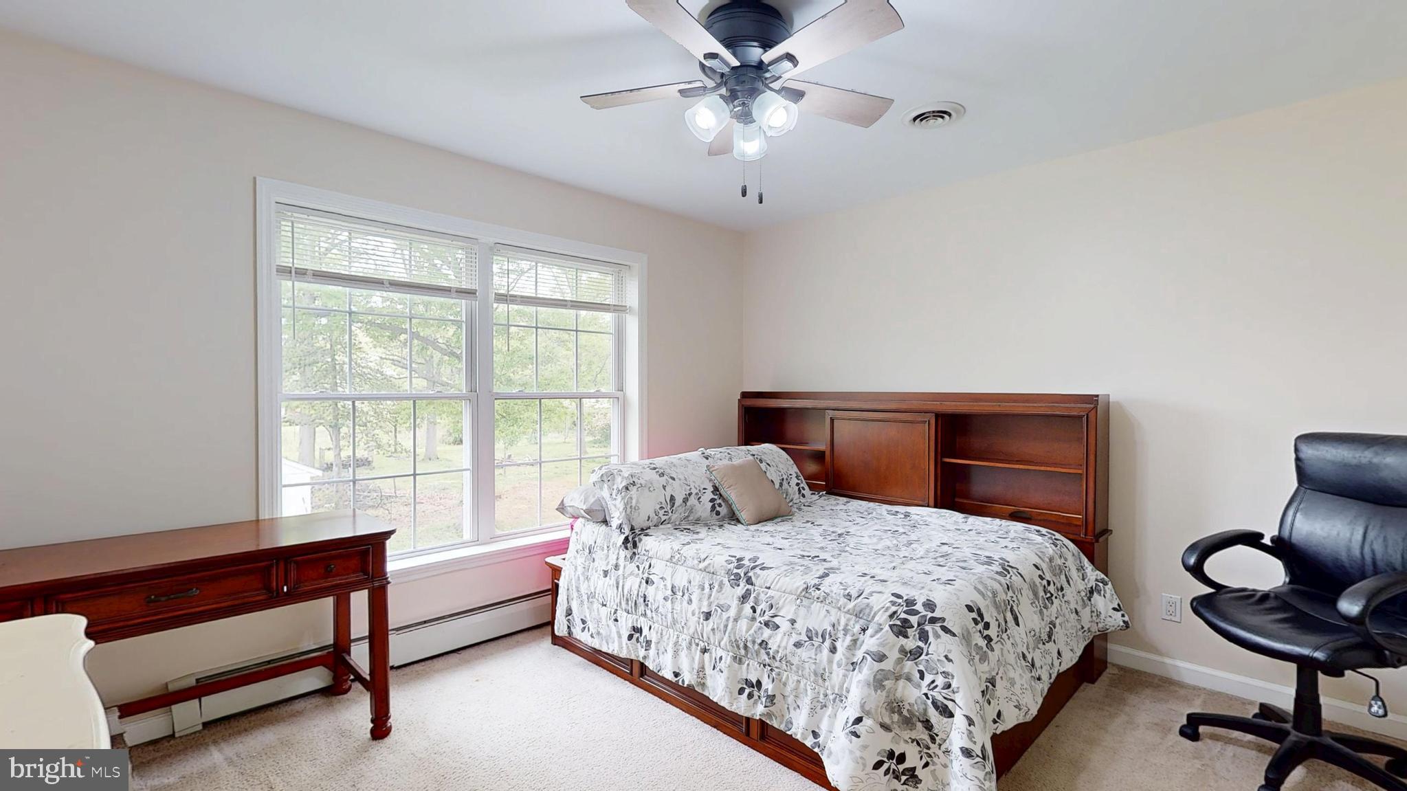 226 Ark Road Mount Laurel, NJ 08054 - Photo 40 of 60 a bedroom with a bed and a chandelier