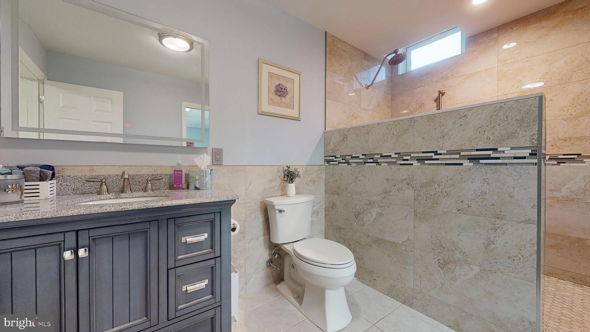 226 Ark Road Mount Laurel, NJ 08054 - Photo 53 of 60 a bathroom with a granite countertop sink a toilet and a mirror