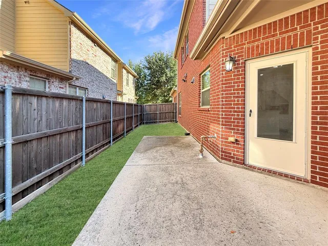 a view of a house with a yard and sitting area