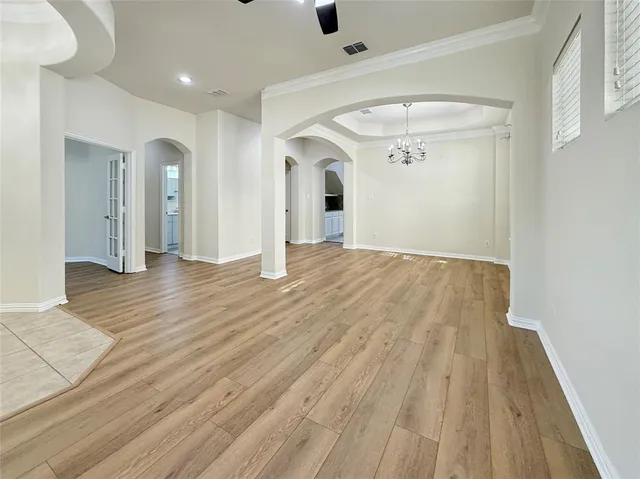 a kitchen with stainless steel appliances granite countertop a sink and dishwasher a refrigerator with white cabinets