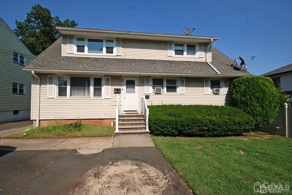 28 Magnolia Road Iselin, NJ 08830 - Photo 3 of 37 front view of a house with a yard
