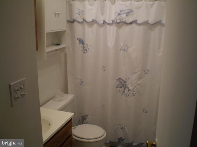 5447 Princess Drive Rosedale, MD 21237 - Photo 12 of 16 a bathroom with a toilet and a shower