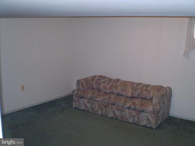 5447 Princess Drive Rosedale, MD 21237 - Photo 9 of 16 a living room with a couch