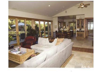 18300 Morgan Valley Road Lower Lake, CA 95457 - Photo 3 of 55 a living room with a large window and a table