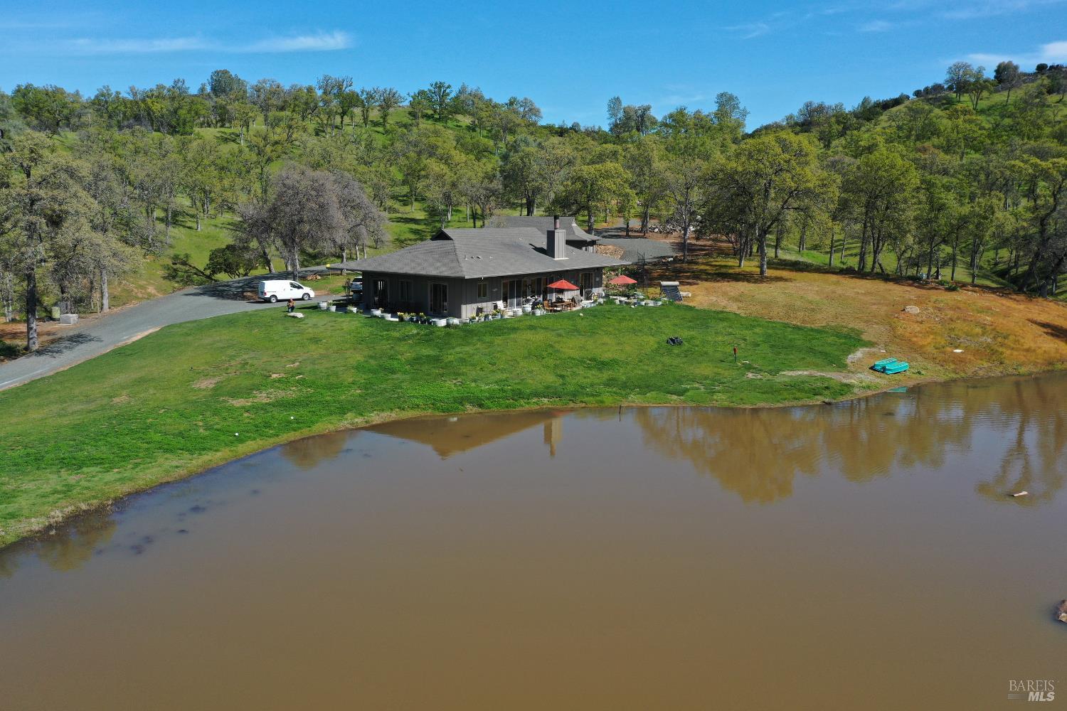 18300 Morgan Valley Road Lower Lake, CA 95457 - Photo 38 of 55 an aerial view of a house with a yard and lake view