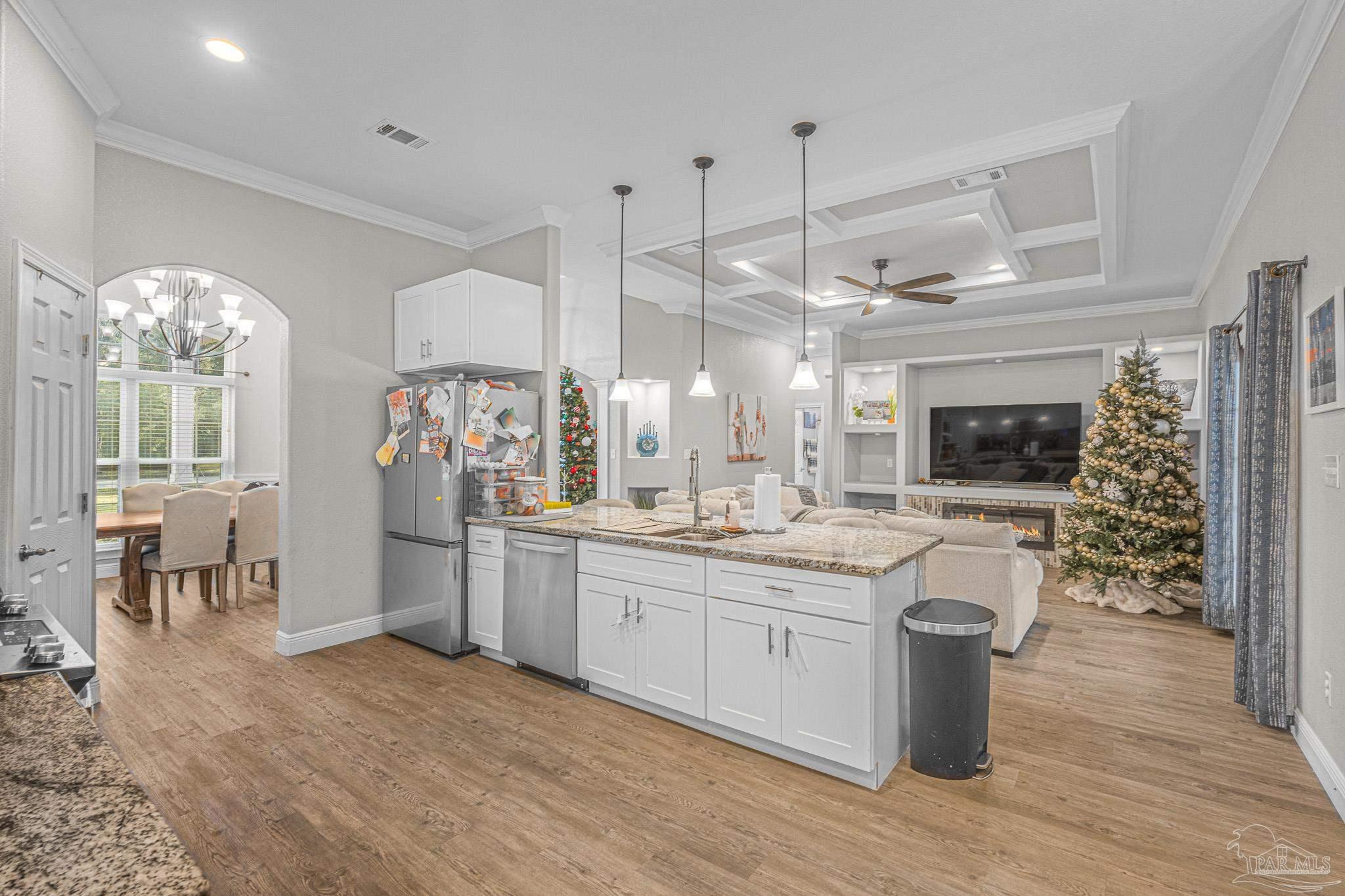 6245 Muldoon Road Pensacola, FL 32526 - Photo 15 of 44 a kitchen with center island and wooden floor
