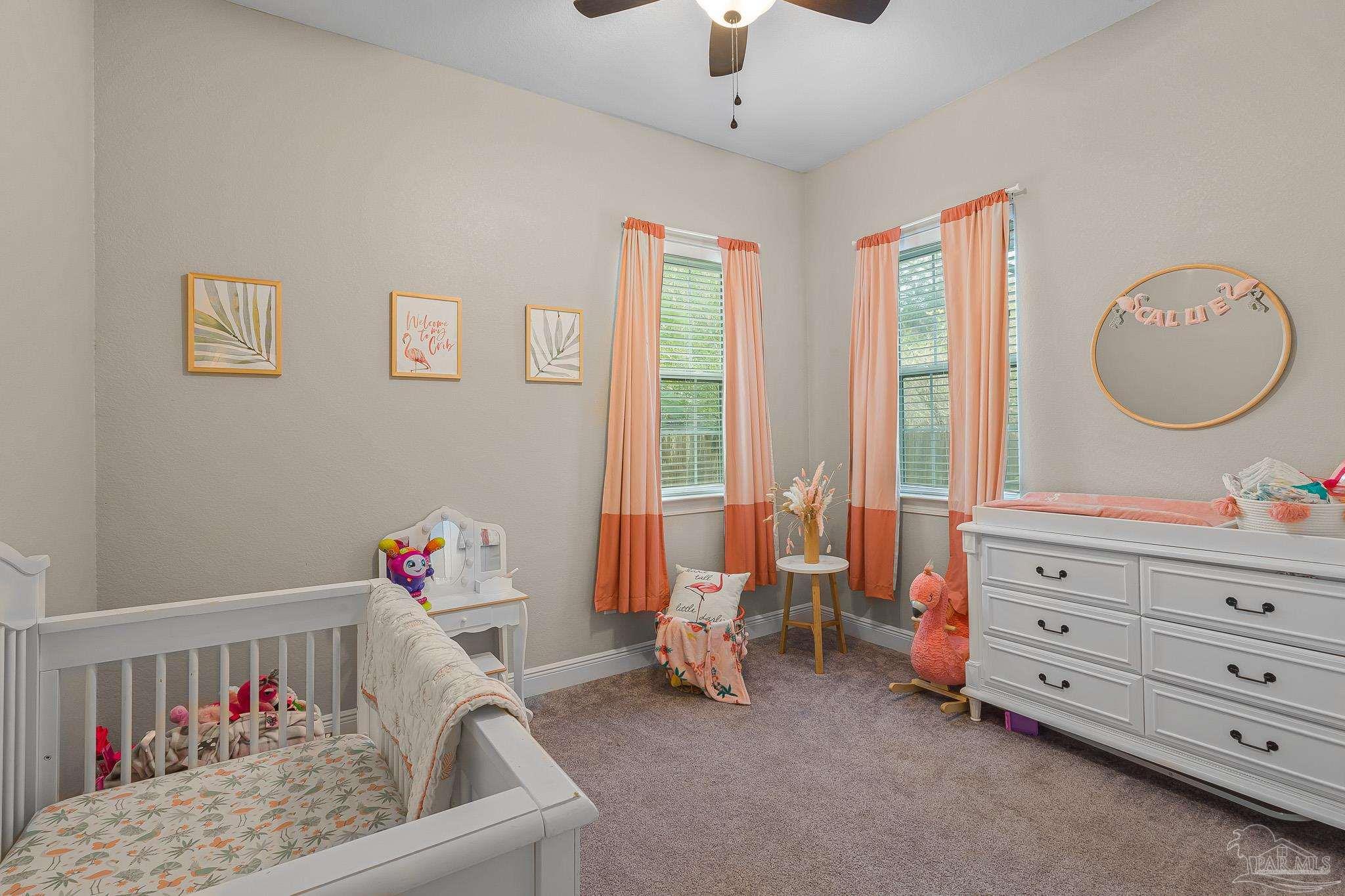 6245 Muldoon Road Pensacola, FL 32526 - Photo 17 of 44 a living room with furniture and a baby crib