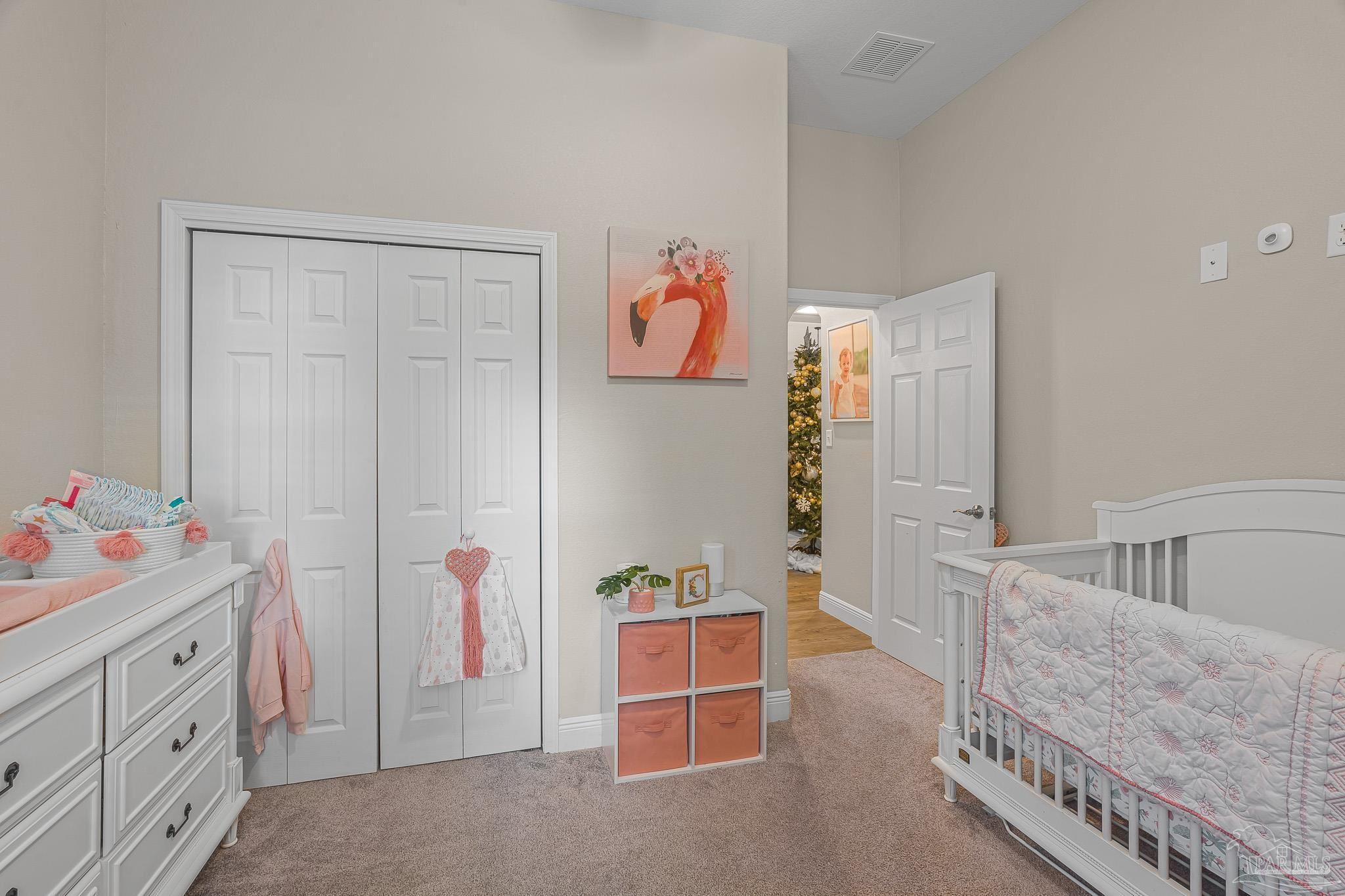 6245 Muldoon Road Pensacola, FL 32526 - Photo 18 of 44 a view of room with baby crib and cabinet