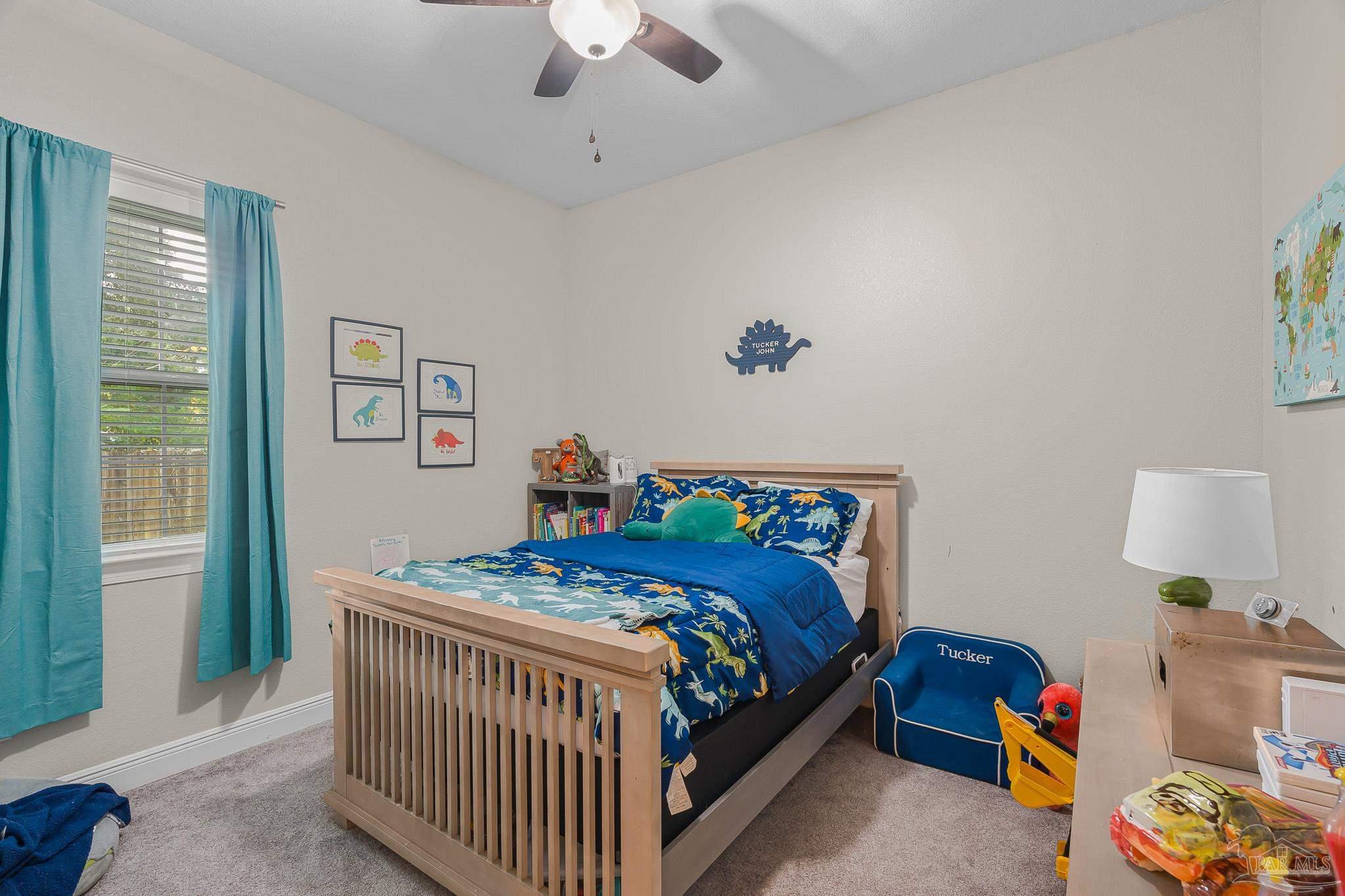 6245 Muldoon Road Pensacola, FL 32526 - Photo 20 of 44 a bedroom with a bed and a window