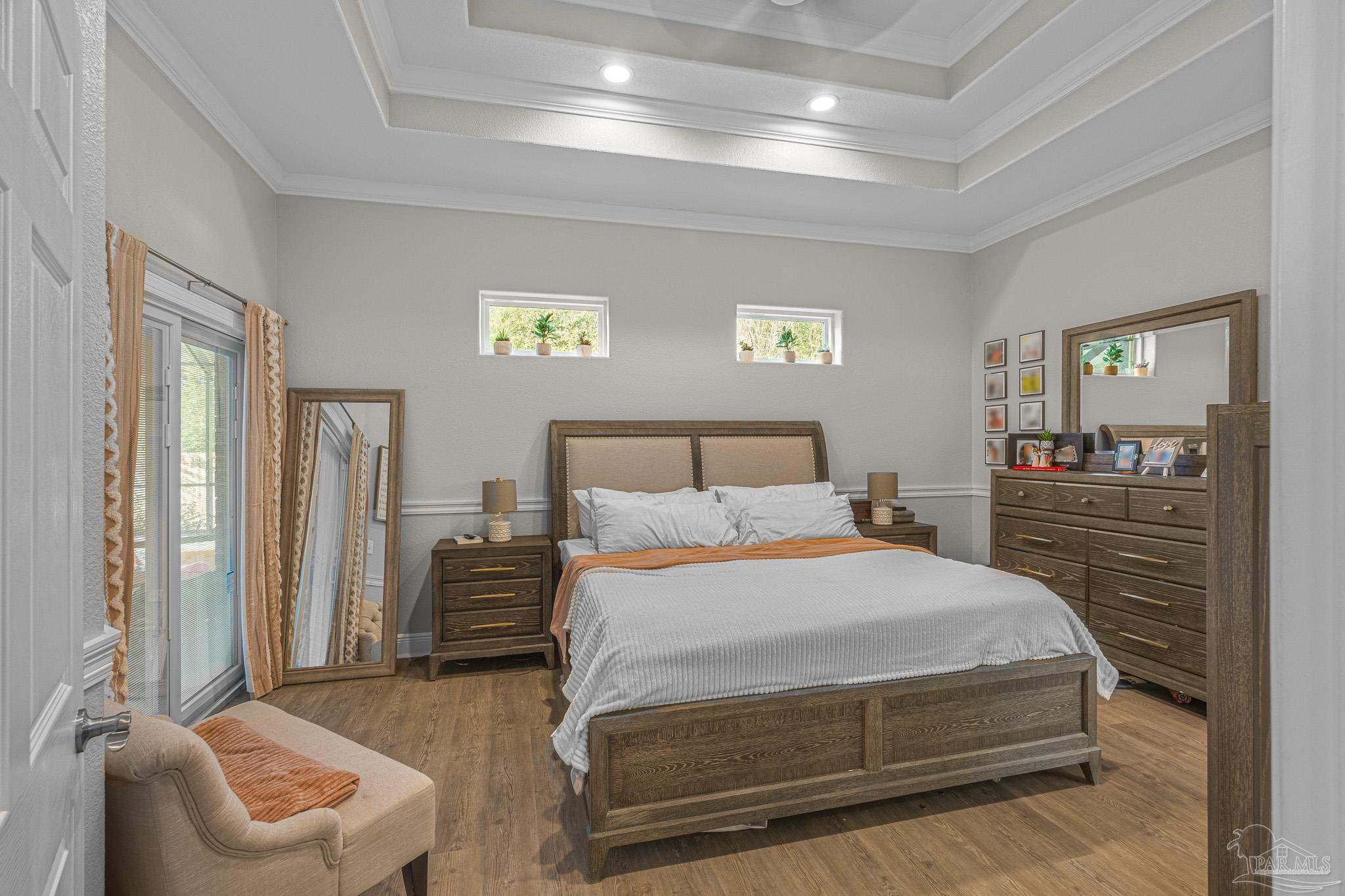 6245 Muldoon Road Pensacola, FL 32526 - Photo 25 of 44 a bedroom with a bed and a couch