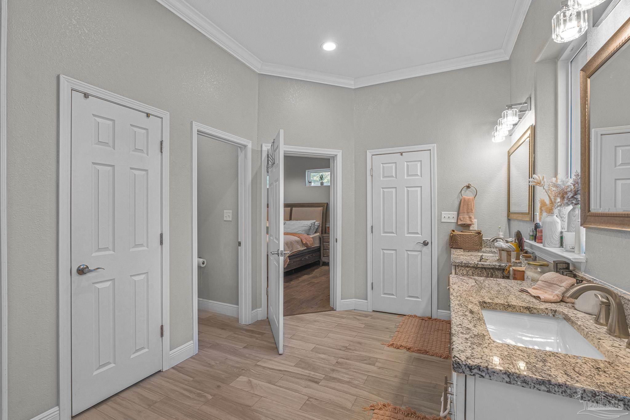 6245 Muldoon Road Pensacola, FL 32526 - Photo 32 of 44 a bathroom with a granite countertop sink and a mirror