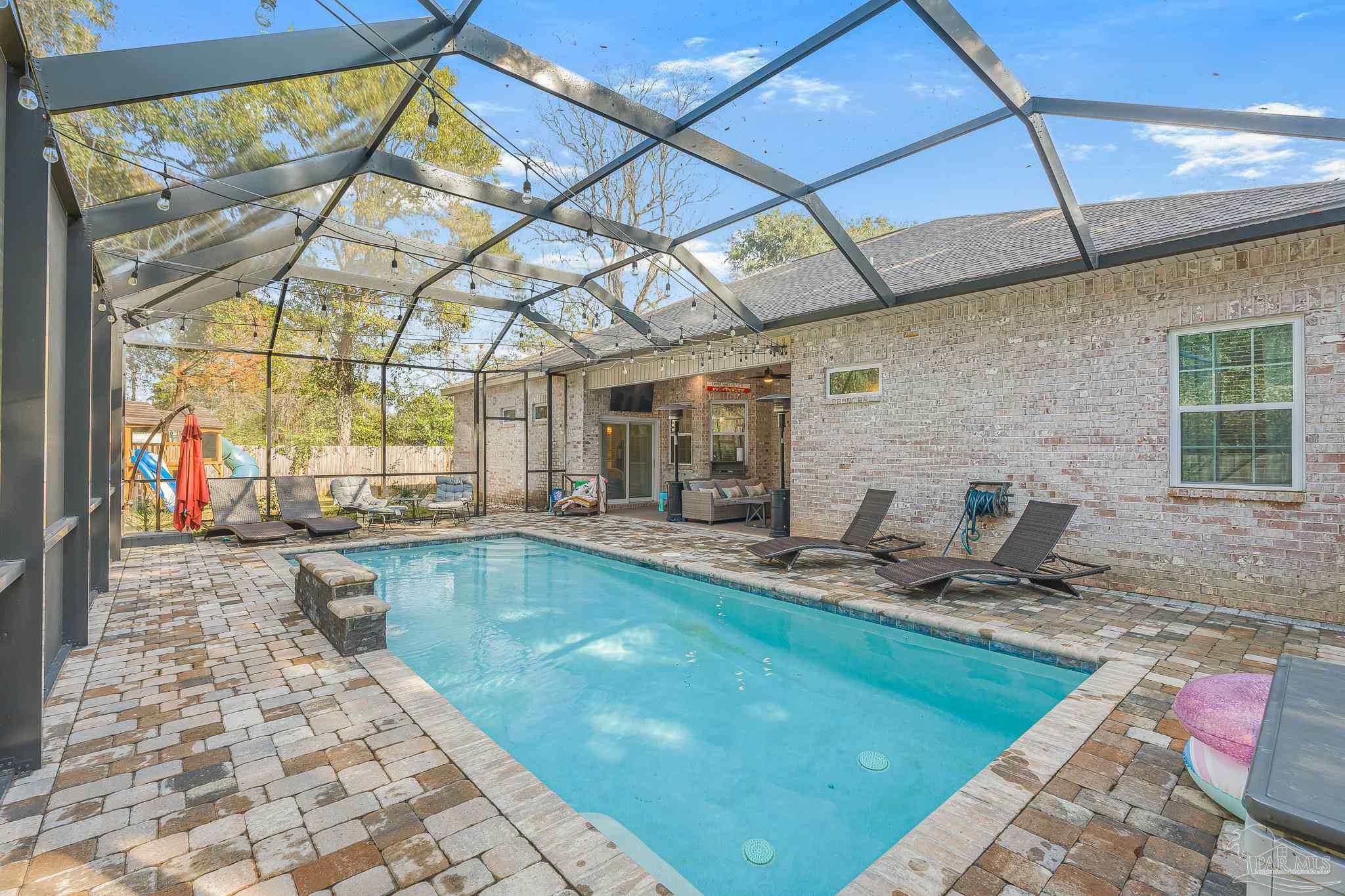 6245 Muldoon Road Pensacola, FL 32526 - Photo 35 of 44 a swimming pool with outdoor seating