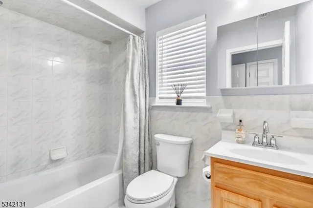 a bathroom with a sink a toilet and a bathtub