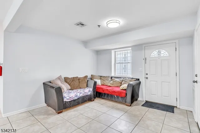 a living room with furniture and window