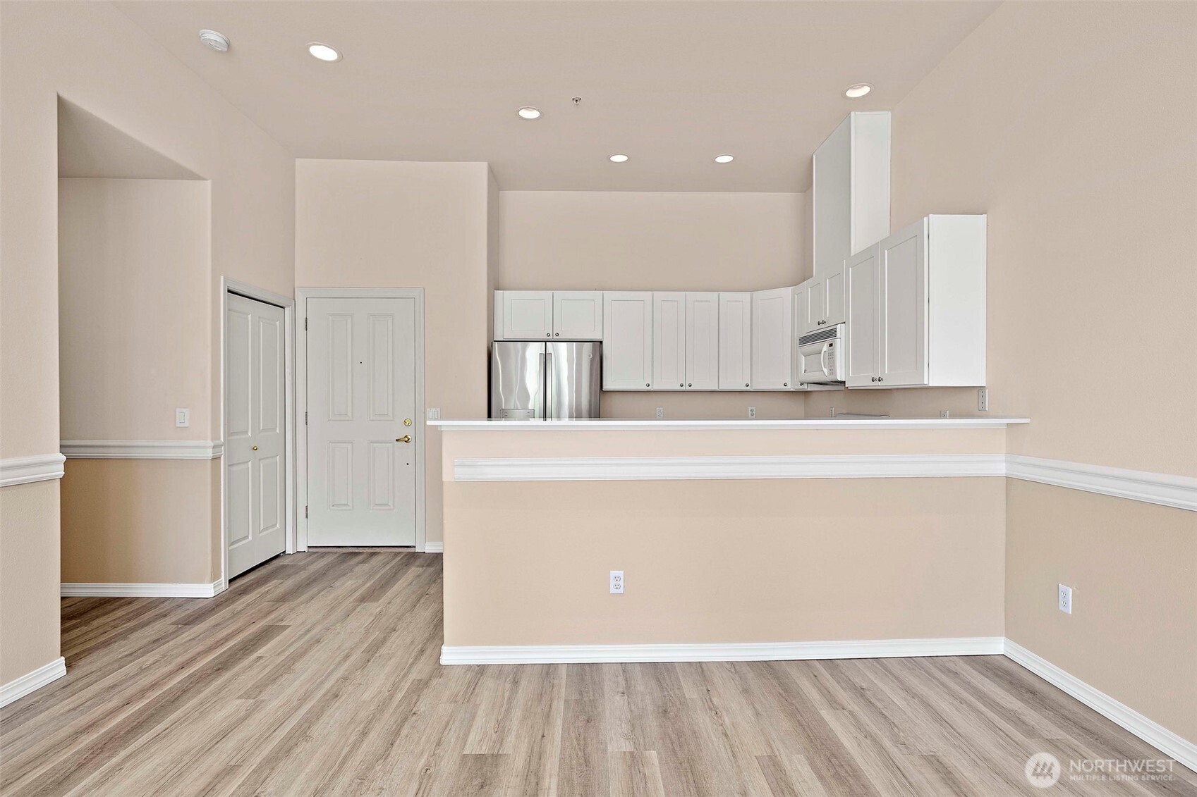 6831 Northeast 170th Street, Unit 306 Kenmore, WA 98028 - Photo 13 of 32 a view of a kitchen with wooden floor
