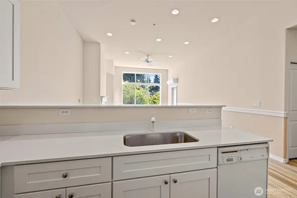 a kitchen with a sink and cabinets