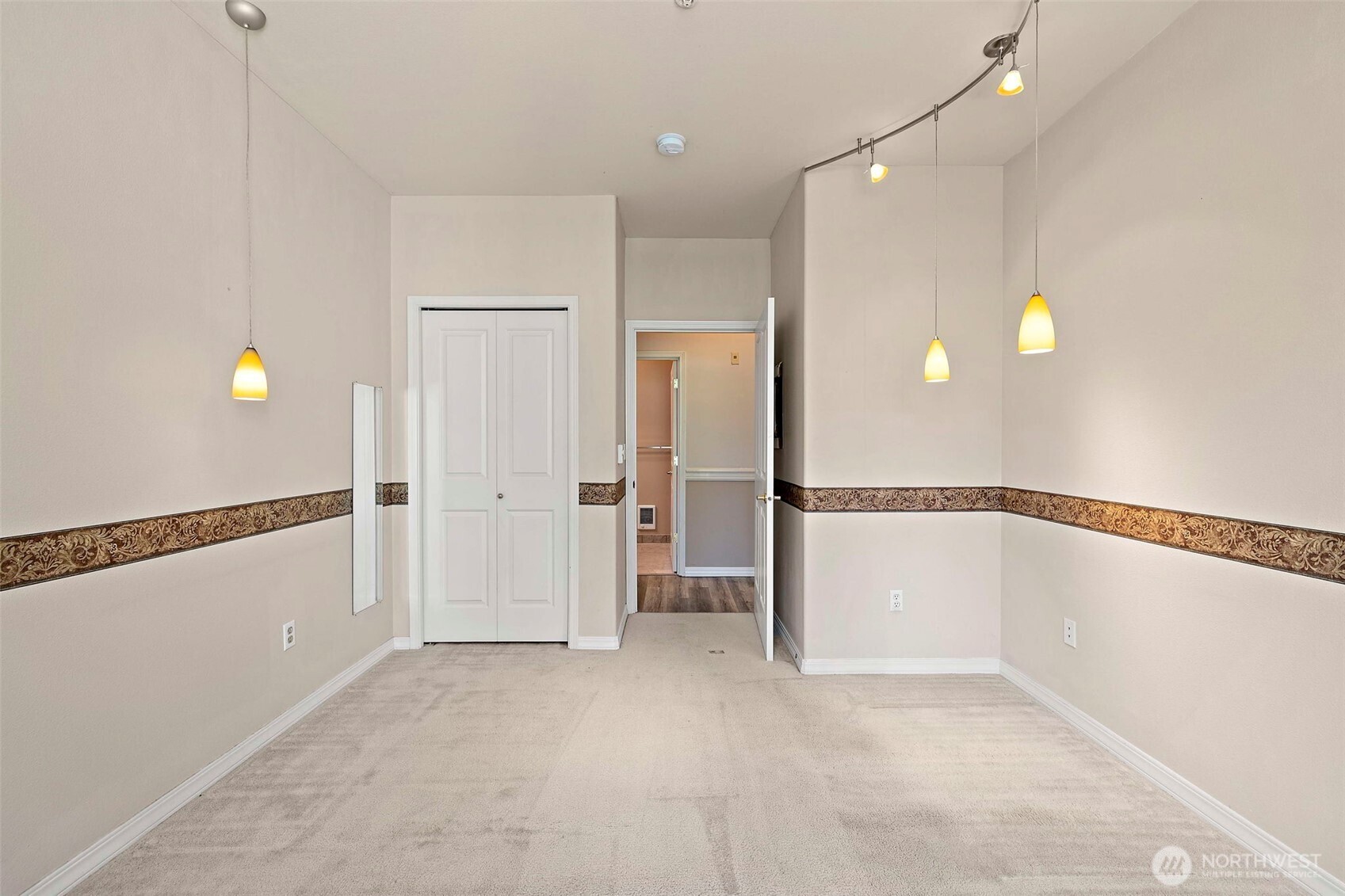 6831 Northeast 170th Street, Unit 306 Kenmore, WA 98028 - Photo 19 of 32 a view of an empty room and window