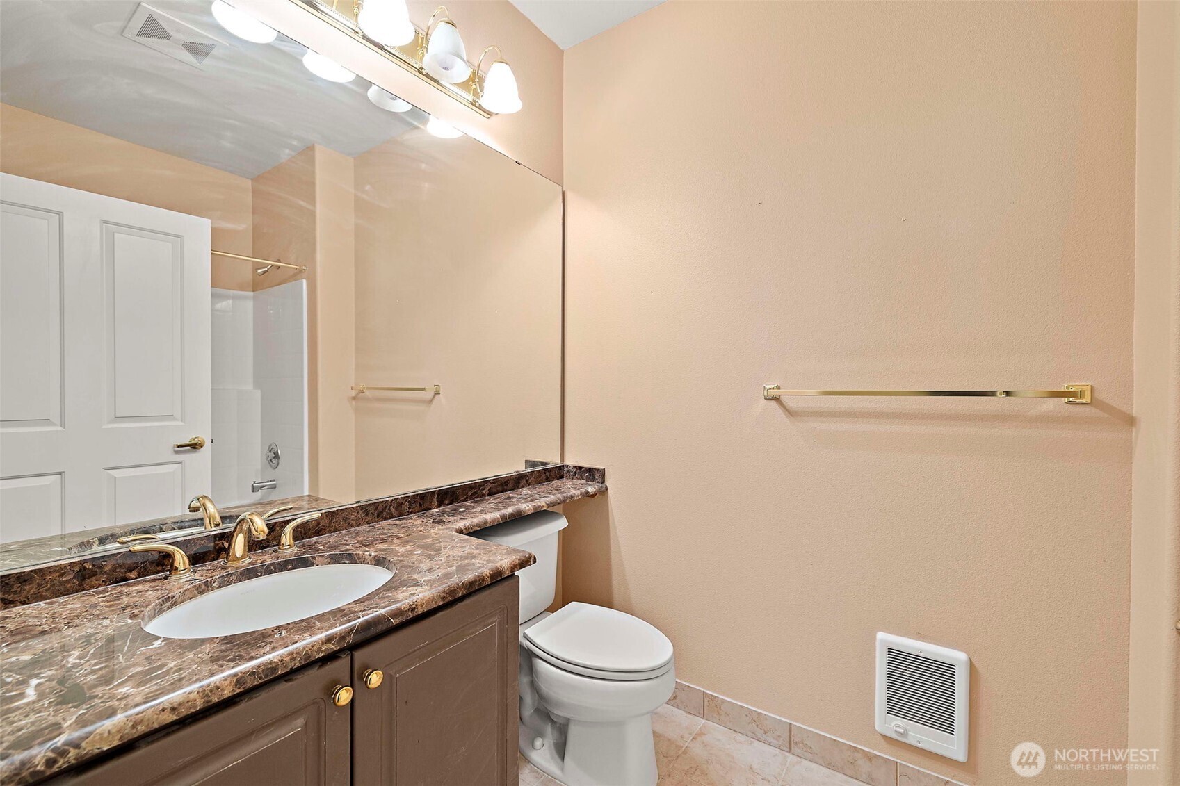 6831 Northeast 170th Street, Unit 306 Kenmore, WA 98028 - Photo 21 of 32 a bathroom with a granite countertop sink toilet and a mirror