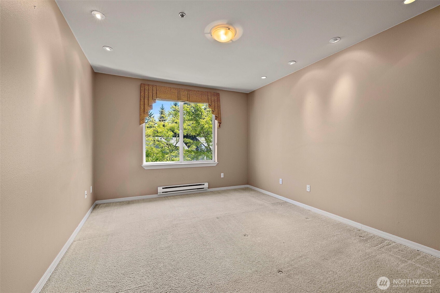 6831 Northeast 170th Street, Unit 306 Kenmore, WA 98028 - Photo 24 of 32 a view of an empty room with a window