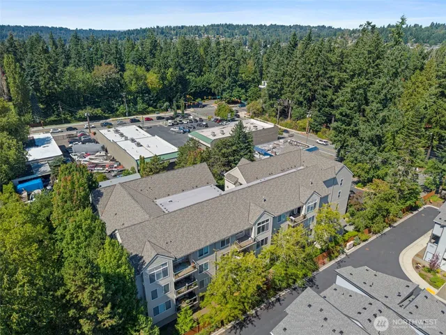 an aerial view of a house with a yard