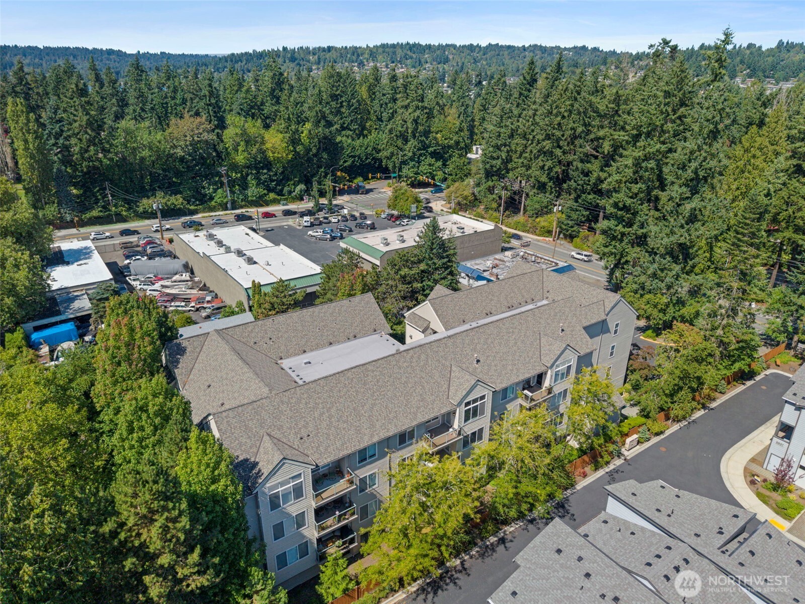 6831 Northeast 170th Street, Unit 306 Kenmore, WA 98028 - Photo 32 of 32 an aerial view of a house with a yard