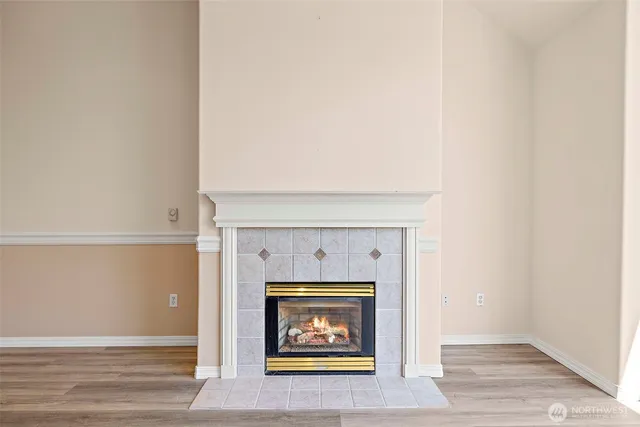 a view of an empty room with a fireplace