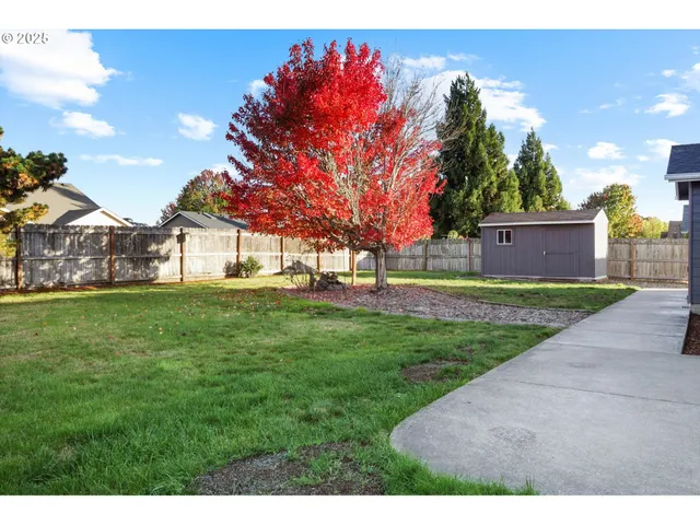 a view of a house with a big yard