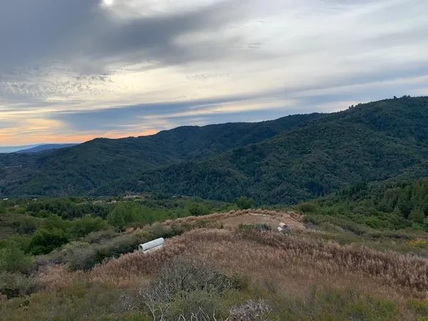 a view of a lake with mountains in the background