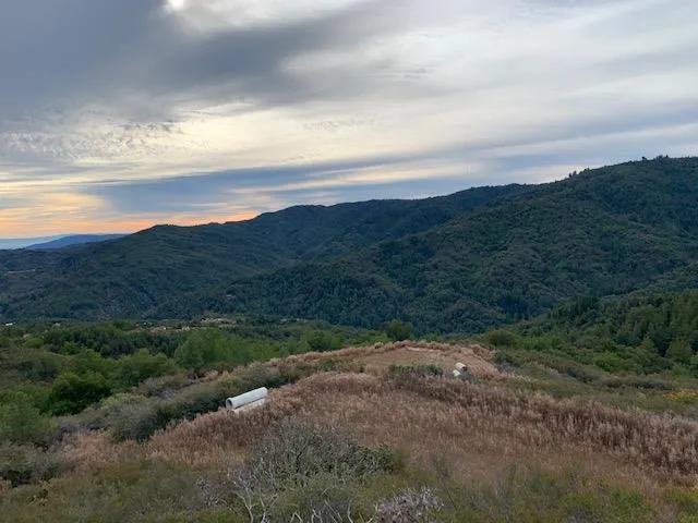 a view of a lake with mountains in the background
