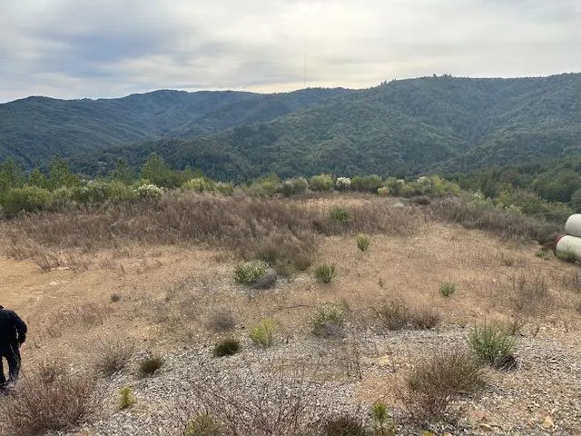 a view of mountains and valleys