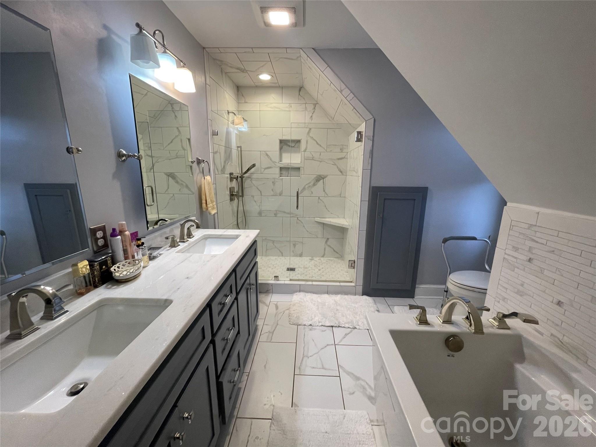 20809 Biles Road Albemarle, NC 28001 - Photo 18 of 39 a spacious bathroom with a sink double vanity mirror and shower