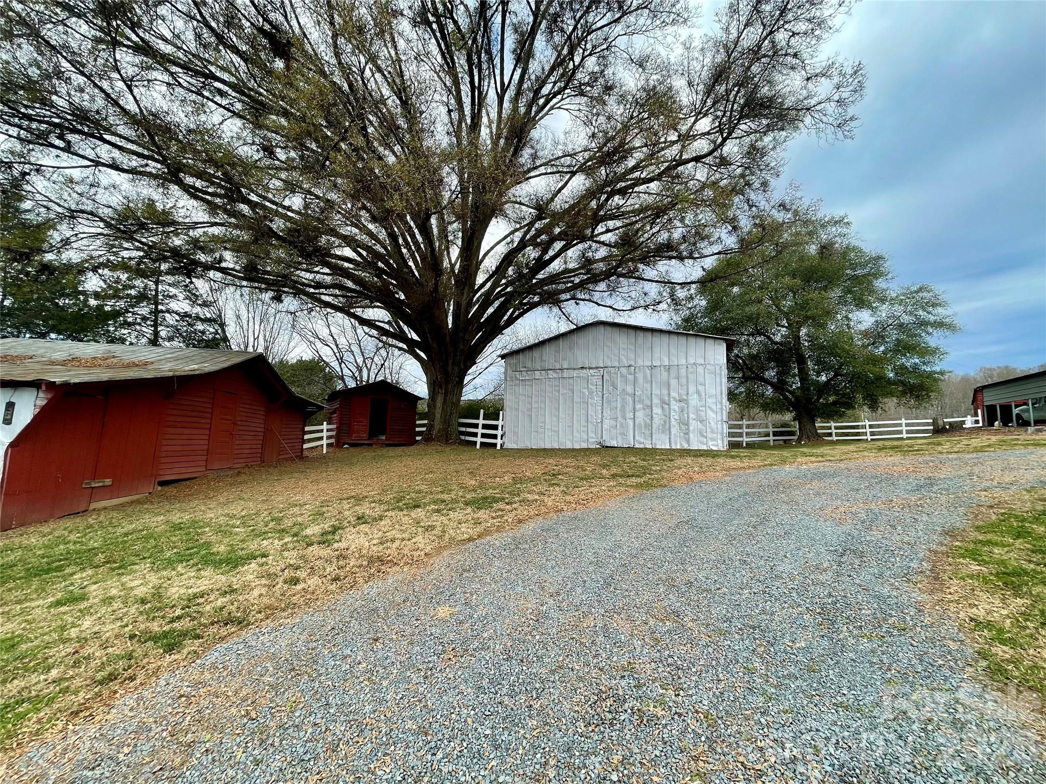20809 Biles Road Albemarle, NC 28001 - Photo 35 of 39 a house with trees in front of it
