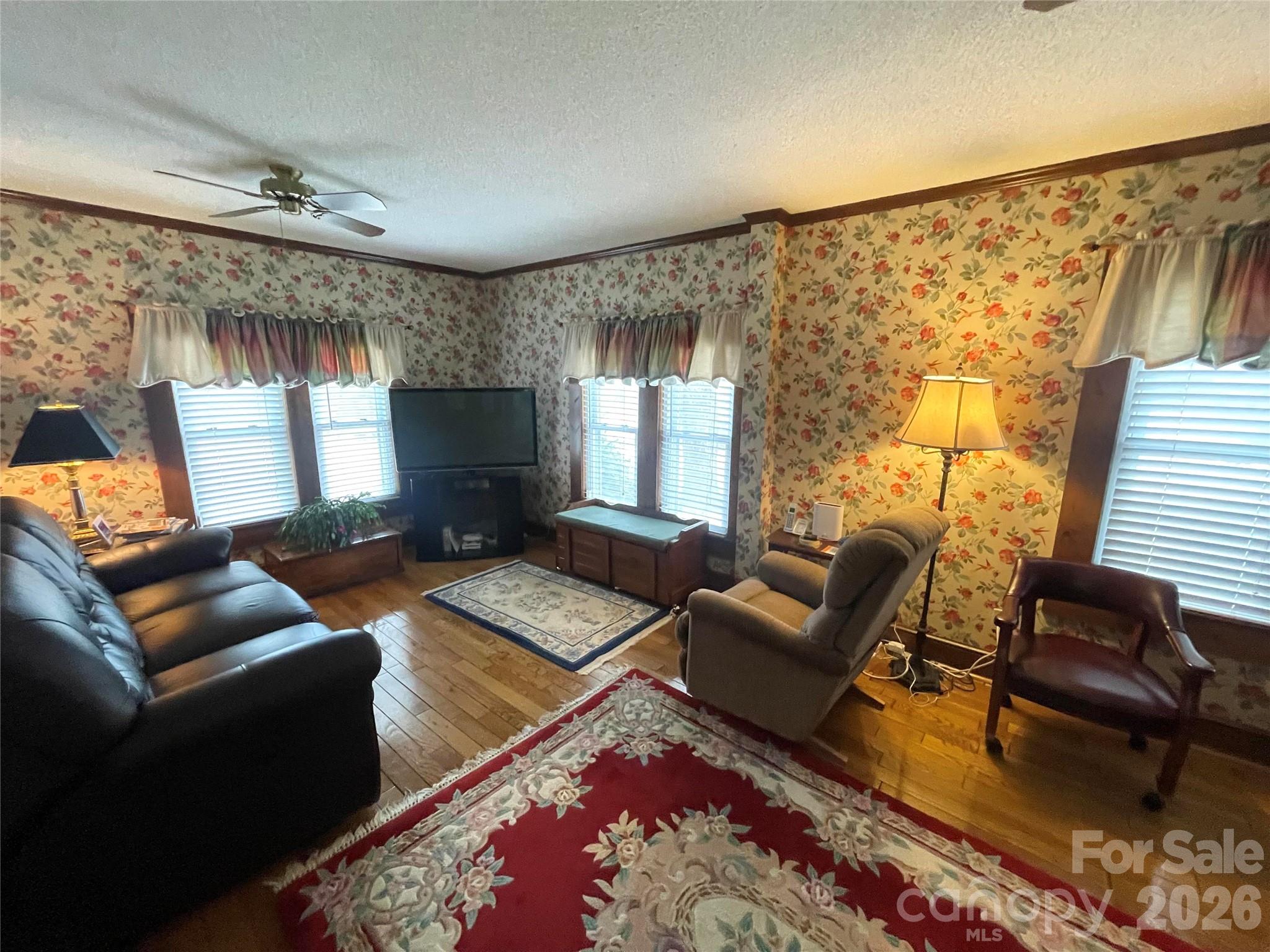 20809 Biles Road Albemarle, NC 28001 - Photo 10 of 39 a living room with furniture and a flat screen tv
