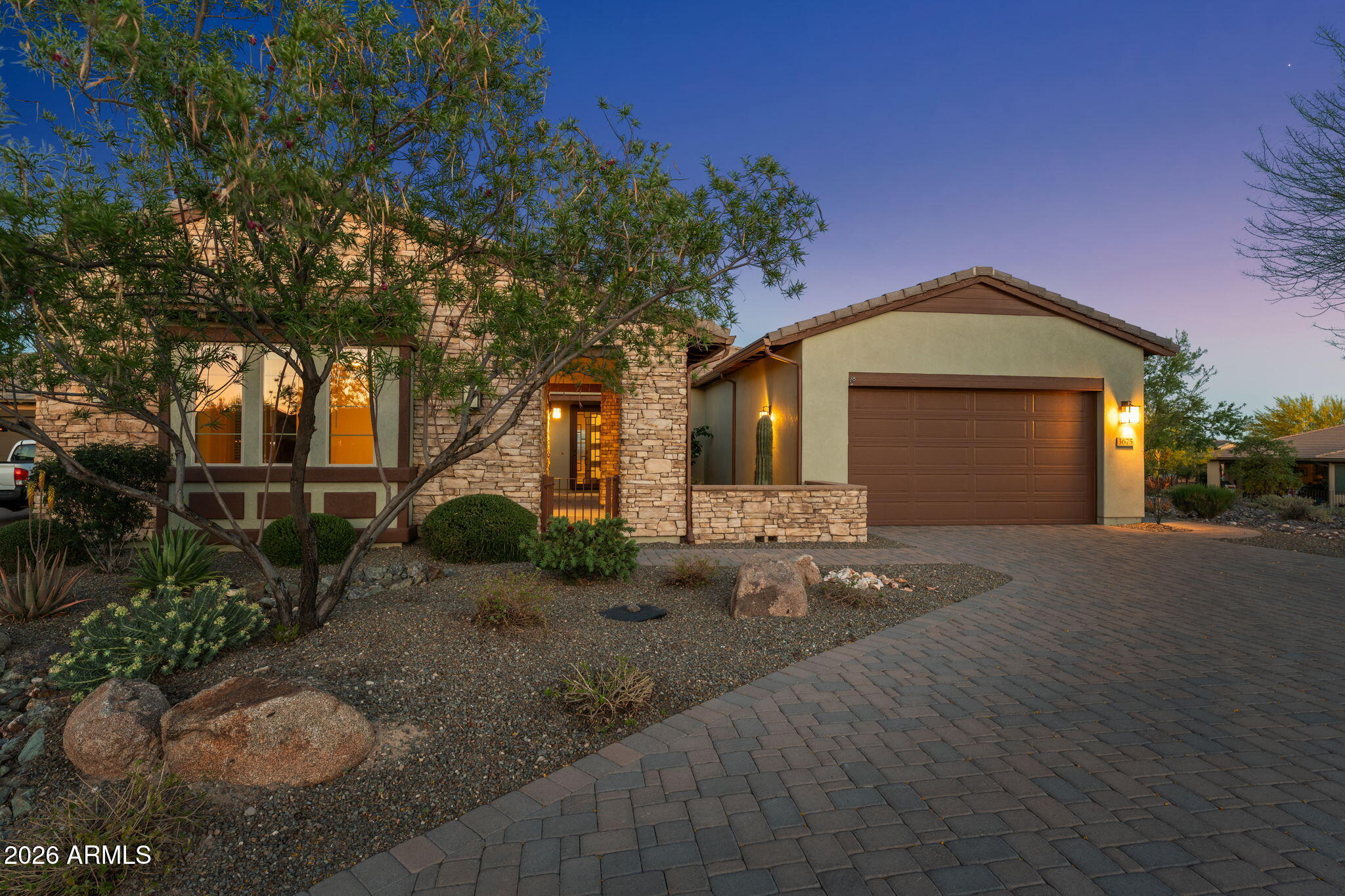 3675 Gold Ridge Road Wickenburg, AZ 85390 - Photo 56 of 58 a front view of a house with garden