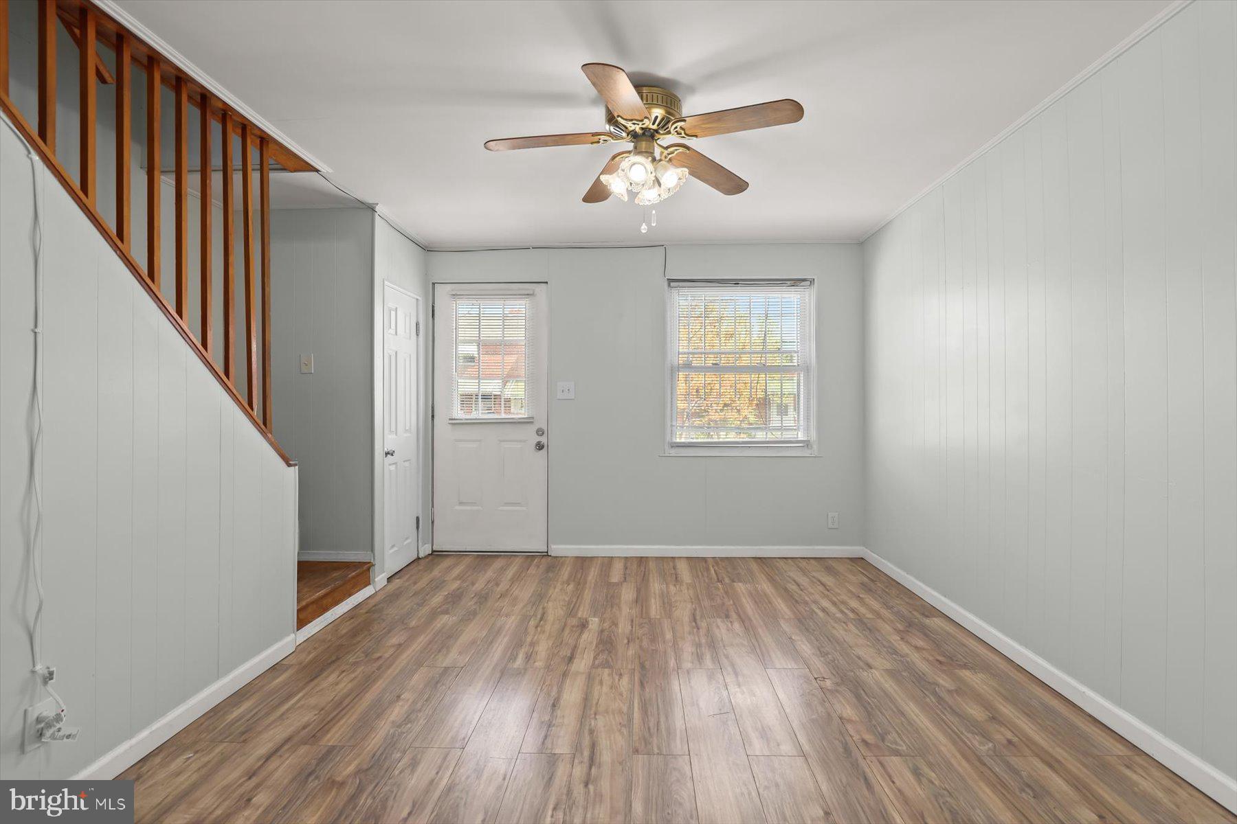 3720 St Victor Street Baltimore, MD 21225 - Photo 11 of 41 wooden floor in an empty room with a window
