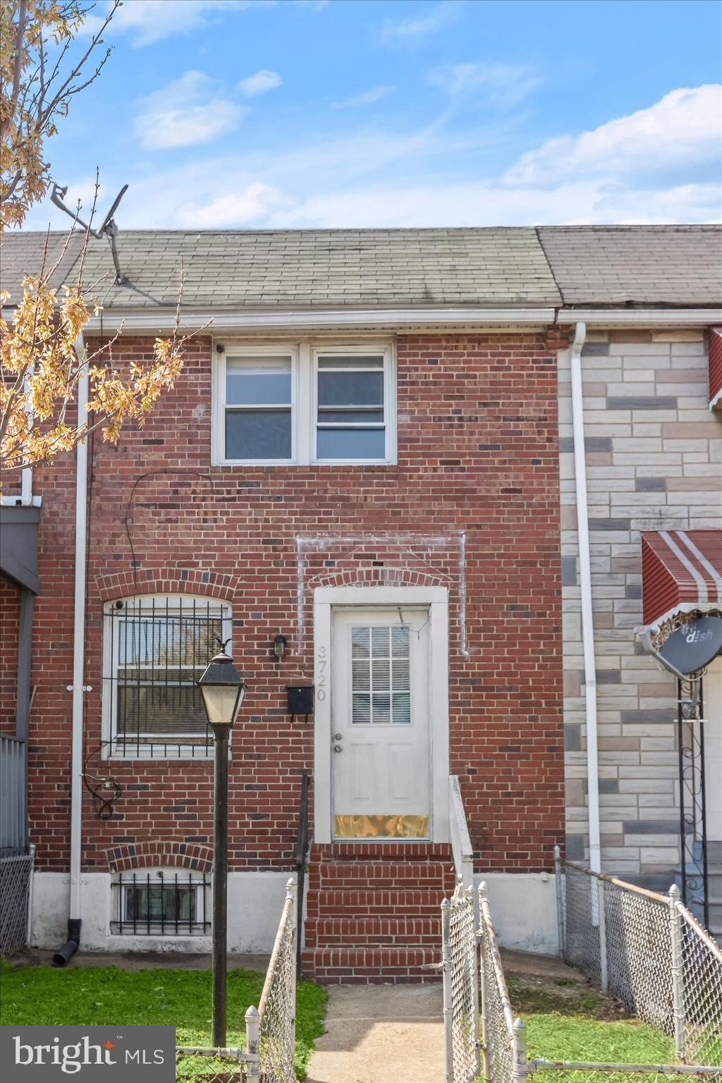 3720 St Victor Street Baltimore, MD 21225 - Photo 2 of 41 a front view of a house with garden