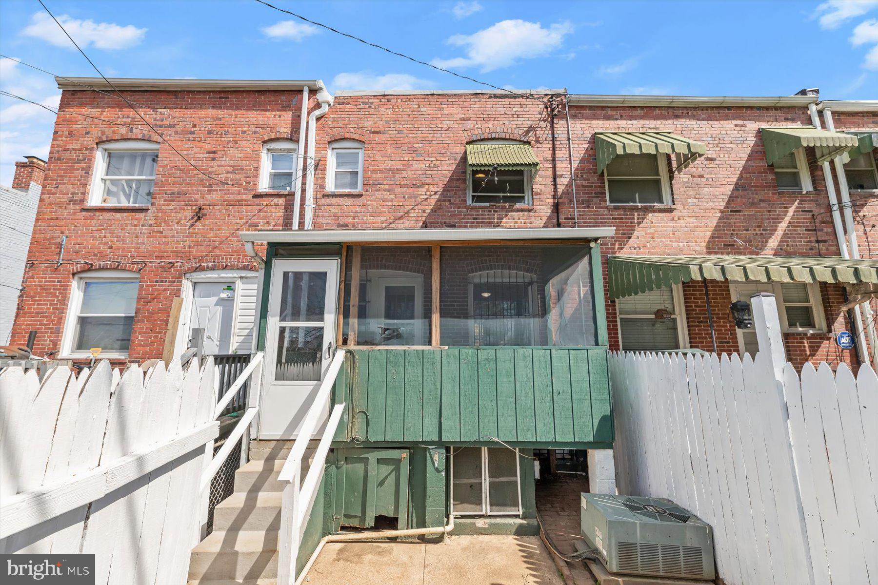 3720 St Victor Street Baltimore, MD 21225 - Photo 35 of 41 front view of a house with a yard