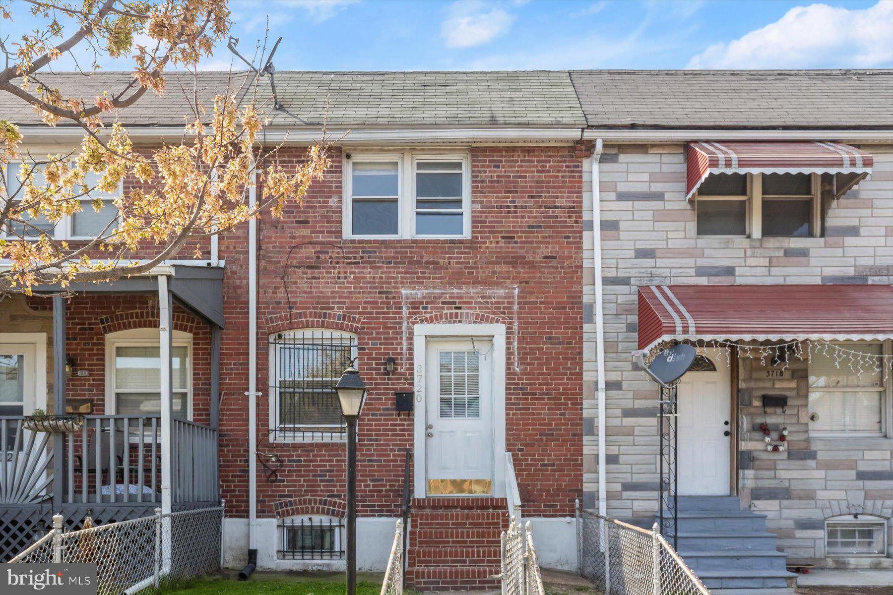 3720 St Victor Street Baltimore, MD 21225 - Photo 39 of 41 a front view of a house with glass windows